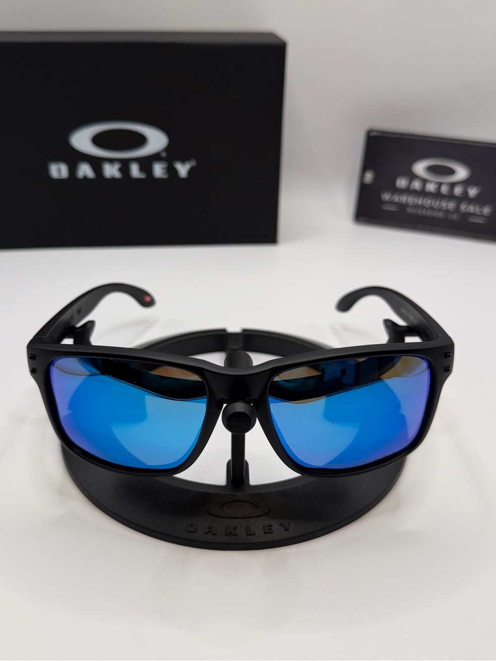 Oakley Black Frame Sunglasses with Blue Mirrored Lenses